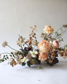 a bunch of flowers that are sitting on a table