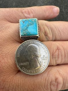 Mens Real solid 925 silver blue turquoise ring.
 NATURAL stone - No two rings are alike as you can see from photos!
Turquoise is a semi precious gemstone found all over the world with some of the best specimens found right here in New Mexico, USA.
Comes from New Mexico, USA - cut by a 4th generation Native American stone cutter
 
 
Nice square stone 
 
Very classy design that can be worn everyday with any outfit!
Solid 925 sterling silver. Stamped 925
Nice oxidized rhodium ridges that gives it a vintage look!
Natural gemstone...semi precious stone!Stone measures 12x12mm (ring is 14x14mm)No two ring are alike...gorgeous handmade item!Weighs roughly 8-9 grams depending on ring sizeCan be worn as a signet ring or as a pinky ring. Even a Rectangular Blue Turquoise Sterling Silver Ring, New Mexico Usa, Two Rings, Classy Design, Square Stone, Pinky Ring, Turquoise Gemstone, Blue Turquoise, Silver Blue