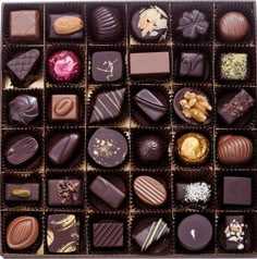 a box filled with lots of different types of chocolates