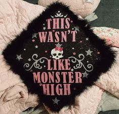 this was not like monster high graduation cap on top of a pile of pink blankets