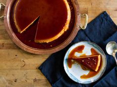 there is a piece of pie on the plate next to it and a cup of coffee