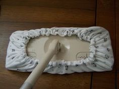 a white toothbrush holder on top of a wooden floor