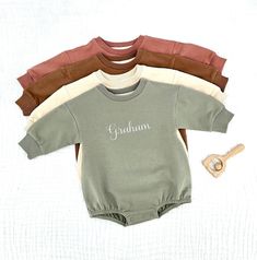 Embroidered Organic Cotton Baby Sweatshirt Romper, Long Sleeve Infant sweatshirt. HOW TO ORDER: In personalization box please include: 1. Name or word (only one word please) 2. Font number (check font chart) 3. Thread number (check thread color chart) Material: -95% Organic Cotton -5% Spandex    CARE: Hand or machine wash in cold or worm water. Tumble dry low heat or hang to dry. The embroidery can be ironed from the back on low-medium heat to remove any wrinkles. Sweatshirt Rompers are very soft and light weight, they are perfect for year-round.  Each Sweatshirt Romper is made to order, because is personalized it cannot be returned or replaced for a different size or color. Customizable Long Sleeve Family Matching Sweatshirt, Family Matching Long Sleeve Sweatshirt With Name Print, Customizable Long Sleeve Cotton Onesie, Cute Long Sleeve Sweatshirt For Birthday, Personalized Name Print Long Sleeve Sweatshirt, Personalized Name Print Sweatshirt As Gift, Personalized Sweatshirt For Gift, Long Sleeve Sweatshirt With Name Print As Gift, Personalized Long Sleeve Sweatshirt As Gift