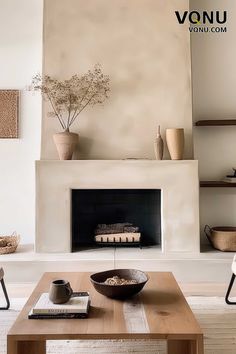 Minimalist fireplace with natural decor elements and neutral tones, creating a serene and inviting atmosphere. Wabi Sabi Fireplace Decor, Earthy Fireplace, Modern Mediterranean Fireplace, Modern Organic Fireplace, Fireplace Minimal, California Fireplace, Japandi Fireplace