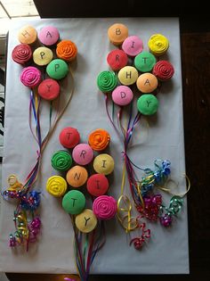 the birthday cake is decorated with colorful icing and flowers on it's side