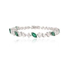 This is part of Chairish’s Fine Jewelry assortment.  This Magnificent Emerald and Diamond Tennis Bracelet in 18K gold showcases endlessly sparkling natural emerald, weighing 2.17 carat and diamonds weighing 2.16 carats. It measures 7 inches long in length.  Emerald enhances intellectual capacity of the person. Designed with perfect marquise cut emerald set with different cut diamonds after each emerald to make you stand out on any occasion or event. The elegant style complements the attire beaut Formal Emerald Diamond Bracelet, Formal Emerald Diamond Bracelet With Brilliant Cut, Green Diamond Bracelet With Brilliant Cut, Green Diamond Bracelets With Brilliant Cut, Elegant White Gold Diamond Bracelet With Emerald, Fine Jewelry Emerald Bracelet With Brilliant Cut, Luxury Green Brilliant Cut Diamond Bracelet, Elegant White Gold Emerald Tennis Bracelet, Elegant White Gold Tennis Bracelet With Emeralds