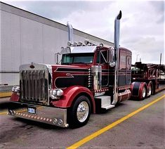 a large semi truck parked in a parking lot