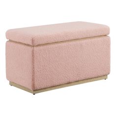 a pink ottoman that is sitting on top of a table