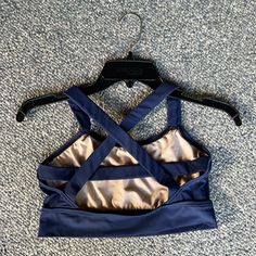 Never Worn Balera Medium Navy Blue Sports Bra, Crop Top, Dance Top Unique Crossing Straps In The Back Great For Dance Class Or Dance Performances Fitted Blue Activewear With Built-in Padding, Fitted Sleeveless Blue Sports Bra, Navy Fitted Yoga Activewear, Blue Stretch Sports Bra With Built-in Padding, Blue Sports Bra With Built-in Bra For Workout, Stretch Dancewear Tops, Stretch Dancewear Tops For Sports, Stretch Tops For Dancewear And Sports, Blue Top For Summer Pilates