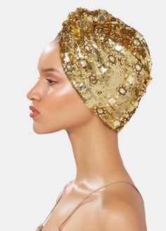 Hand made heavy sequin-embellished turban in gold tones on satin, Incrusted tonal jewels. One Size This is a unique accessory designed by MARYJANE CLAVEROL. Each piece has been carefully hand made with local artisans using the finest materials to become an essential piece in your wardrobe while keeping traditional handcrafting techniques alive. Any variations are due to its small scale manufacturing. Luxury Gold Sequins Embellishments, Traditional Headband For Party, Gold Beaded Wedding Headpieces, Gold Rhinestone Headpieces For Party, Gold Embellished Headpieces For Wedding, Traditional Gold Turban Headband, Traditional Gold Headband Turban, Elegant Gold Festive Headpieces, Gold Turban Headband For Party