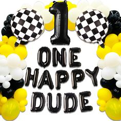 one happy dude 1st birthday balloon arch with black and white balloons in the shape of mickey mouse ears