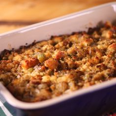 a casserole dish filled with stuffing and vegetables