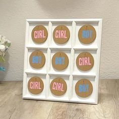 a white box with pink and blue stickers on it that says girl, not girl