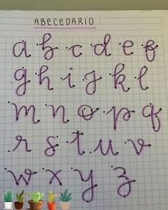 the writing is written in purple ink on a sheet of paper with numbers and letters