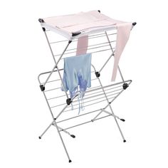 an ironing board with clothes on it and a pink scarf hanging from the top