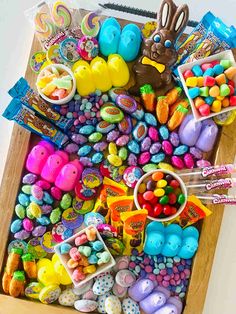 a tray filled with lots of candy and candies