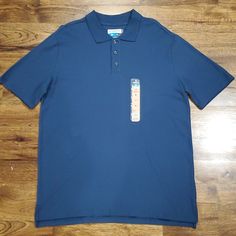 New With Tags This Mens Magellan Outdoors Blue Polo Shirt Is A Size Medium. It Is A Classic Fit Fish Gear Shirt That Has 3 Buttons At The Chest And Has Moisture Wicking. Made Of 100% Cotton. Measurements Are 31 Inches From Shoulder To Bottom And 23 Inches Armpit To Armpit. Blue Polo Collar Shirt With Relaxed Fit, Blue Relaxed Fit Polo Shirt, Blue Relaxed Fit Short Sleeve Polo Shirt, Blue Polo Shirt, Black Polo Shirt, Blue Polo Shirts, Outdoor Shirt, Black Polo, Polo Blue