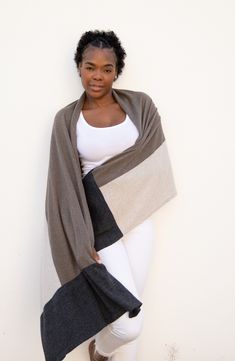 An ultrasoft and stylish scarf made of plush organic cotton is a travel essential and can be used as a shawl or blanket to keep you comfortable anywhere you go. 28" x 78" 100% organic cotton Machine wash, tumble dry Imported Knit Pom Pom Hat, Wrap Clothing, Travel Scarf, Stylish Scarves, Unique Hats, Sustainable Brand, Cotton Throws, For A Reason, Knit Outfit