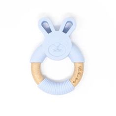 a wooden teethpick with a blue bunny face on it