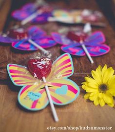 some lollipops and flowers on a table