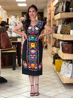 -This Beautiful Long Mexican Colorful Floral Dress is the perfect dress for a fun night out or a special event. -It is full of colorful embroidered flowers and has some crocheted details. -This dress has ties on the back in order to adjust the fit. - You can purchase the dress either with or without the belt. Available size: S - 2X. Please note: The accesories shown with this dress may purchased as well and Can be found in this links Earrings:https://www.etsy.com/es/listing/855938626/aretes-mexi Multicolor Embroidery Short Sleeve Party Dresses, Short Sleeve Embroidered Dress For Party, Multicolor Embroidered Short Sleeve Dress For Party, Short Sleeve Embroidered Dress With Multicolor Embroidery For Party, Party Dress With Multicolor Embroidery And Short Sleeves, Fitted V-neck Dress With Multicolor Embroidery, Fitted Party Dress For Day Of The Dead, Embroidered Short Sleeve Fiesta Dress, Fiesta Embroidered Short Sleeve Dresses