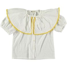 The Nymphea blouse will win over mums for its allure! The ecru colour is enhanced by a curry yellow lace braid, giving it a very cheerful look. Made from organic cotton that's comfortable to wear, and elegant with its bow to tie at the base of the collar, it's a must-have for the new season. Its wide collar is right on trend and gives the blouse a chic edge. Available here in ecru textured cotton, it's sure to find the perfect piece to complete your look. The cotton is certified organic, and the buttons are made from natural mother-of-pearl. | RISU.RISU | Nymphea Print Tie-Bow Wide Collar Blouse, Lily | Organic Cotton (White, Size 4Y) | Maisonette collects the best children’s products from around the world (unlike Zulily, Etsy, The Tot, Farfetch Kids, Childrensalon, Crate and Kids, Kohls, Beige Cotton Top With Ruffled Collar, Beige Cotton Tops With Ruffled Collar, White Cotton Top With Ruffled Collar, White Ruffled Collar Shirt For Summer, White Summer Shirt With Ruffled Collar, White Shirt With Ruffled Collar For Summer, Off White Cotton Short Sleeve Blouse, Clara Lukasiak, Curry Yellow