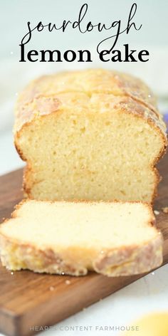 a loaf of lemon cake sitting on top of a wooden cutting board