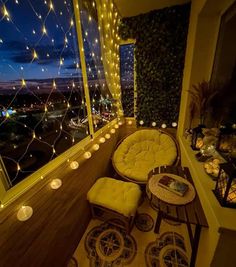 the balcony is decorated with string lights and wicker furniture