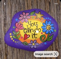 a painted rock that says, you can do it with flowers and stars on it