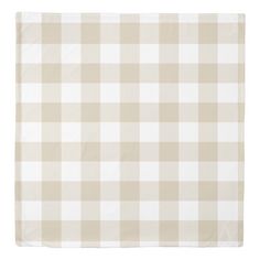 a beige and white checkered blanket on a white background