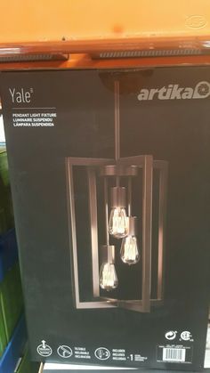 the light fixture is in its box on display for sale at an artka store