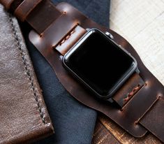 "Handcrafted leather bund strap for Apple Watch Series SE, 6, 5, 4, 3 & 2 - WW2 Military Pilot Bund Strap - Antique Brown FEATURES -Compatible with Apple Watch Series SE, 6, 5, 4, 3 & 2 -Interchangeable Apple Watch spring bar adapter -Single layered leather construction -Standard Length: 80mm/125mm - 3.1\"/ 4.9\" -Thickness: 1.6-1.8mm -Stainless steel buckle included. -Durable waxed thread -Handmade and hand stitched *Measure the buckle and lug width (the width between the area where you Business Brown Bracelet Strap Apple Watch Band, Rectangular Leather Strap Watch Accessories, Adjustable Leather Watch Bands With Wrist Strap, Business Leather Apple Watch Band, Leather Bracelet Strap For Everyday Watch Use, Brown Waxed Finish Apple Watch Band For Everyday Use, Brown Waxed Apple Watch Band For Everyday, Leather Apple Watch Band Perfect As A Gift, Rectangular Brown Leather Watch Bands