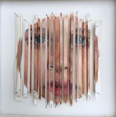 a collage of strips of wood and an image of a woman's face