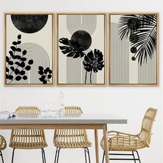 three paintings hang on the wall above a dining room table with wicker chairs around it