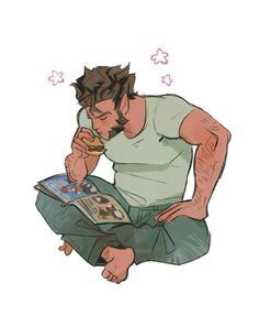 a man sitting on the ground while reading a book and eating something in his hand