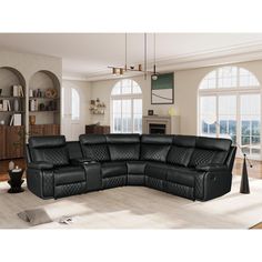 a black leather sectional sofa in a living room