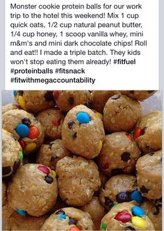 a pile of cookies with m & m's in the middle and candy on top