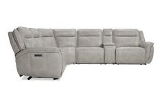 the reclining sectional sofa with power headrests is shown in light gray leather