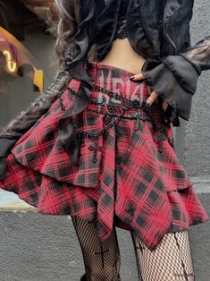 Embrace the Y2K fashion trend with this edgy and unique punk plaid skirt. Featuring a high-waisted A-line silhouette and an irregular hem, this skirt exudes a cool and alternative vibe. Perfect for the summer season, this standout piece is a must-have for those who love to express their individual style.  Please note that this product includes only the skirt or a set.  Garment Size   	 		 			Size 			S 			M 			L 		 		 			Waist 			63 			67 			71 		 		 			Full Length 			35 			36 			37 Punk Asymmetrical Skirt For Alternative Fashion, Emo Bottoms For Spring Streetwear, Punk Mini Skirt For Streetwear, Punk Style Mini Skirt For Streetwear, Punk Style Red Skirt For Halloween, Punk Streetwear Mini Skirt, Punk Red Skirt For Halloween, High Waist Punk Skirt For Streetwear, Punk Streetwear Skirt For Fall