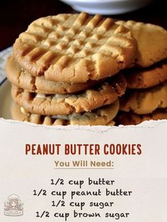 the peanut butter cookies are stacked on top of each other in front of a sign