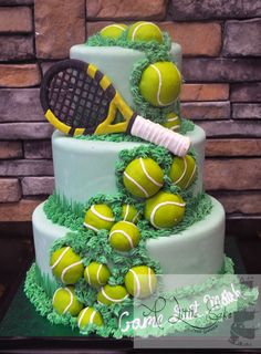 a cake with tennis balls and a racket on top