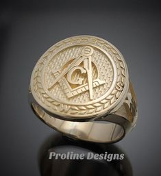 Made entirely in the U.S.A. Ring Details~ Bold - Handsome - Exquisitely Finished - Original The newest addition to our Prestige Collection, this gold version of our moral compass ring is sure to stand out. The top prominently features the square and compass with the four directions around the outer edge. The side windows display the symbolic trowel and level on a textured background. Hand finished to perfection, the high polish creates a contrast against the sandblasted background. All creations Timeless Engraved Ring With Polished Finish, Timeless Polished Engraved Ring With Round Cut, Timeless Gold Engraved Ring, Luxury Anniversary Signet Ring With Maker's Mark, Classic Collectible Rings With Polished Finish, 14k Gold Timeless Signet Ring For Collectible, 14k Gold Timeless Signet Ring Collectible, Yellow Gold Engraved Ring With Maker's Mark, Timeless 14k Gold Signet Ring For Collectors