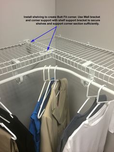 an organized closet with clothes hanging on racks