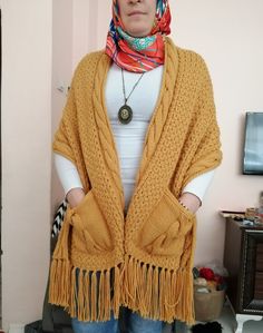 Handmade Yellow Soft Women's Shawl/ Women's Knitwear / Big Scarf / Bohemian Shawl / Wool shawl The thick texture of the shawl I knitted with a skewer will wrap and warm you up on cold days.  When using it as a poncho and shawl, you can carry your pockets and belongings with you.  It was very enjoyable to knit two different models together.  Dimensions  🌼150 cm long, 🌼48 cm wide (measures excluding tassels) .  🌼I knitted it with skewers using 600 g of acrylic wool.  🌼30 Co you can wash Bohemian Knit Shawl Sweater, Bohemian Shawl Knit Sweater, Bohemian Shawl Sweater In Knit, Bohemian Shawl Knitting Pattern, Bohemian Knitted Shawl For Fall, Bohemian Knitted Winter Scarves, Bohemian Knitted Shawl For Winter, Bohemian Hand Knitted Shawl, Bohemian Hand-knitted Shawl