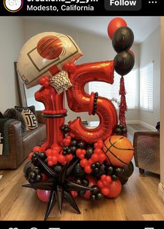 the number five balloon sculpture is made up of basketballs, balloons and streamers