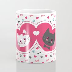 two hearts with cats and bows on them, one has a cat's face in the middle