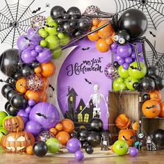 an assortment of halloween balloons and decorations