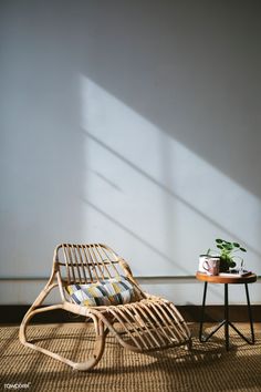 a chair and table with a potted plant next to it