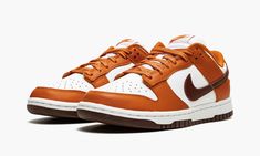 The Women’s Nike Dunk Low “Bronze Eclipse” is a women’s-exclusive colorway of the vintage basketball shoe that arrives in unique, earth tone colors for a versatile, always-in-style look. Reminiscent of Dunk colorways from the early-to-mid 2000s, the ‘Bronze Eclipse” features a white leather base with contrasting Sport Spice-colored leather overlays on the forefoot, eyelets, collar, and heel. A Bronze Eclipse leather Swoosh resides on either side of the shoe. A classic “Nike” logo is embroidered Dunk Colorways, Yeezy 750, Nike X Travis Scott, Low Air Jordan 1, Vintage Basketball, Jordan 8, Earth Tone Colors, Dunks Nike, Jordan 2