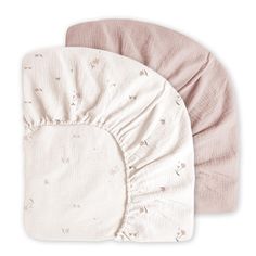 two baby swaddles on top of each other, one pink and the other white